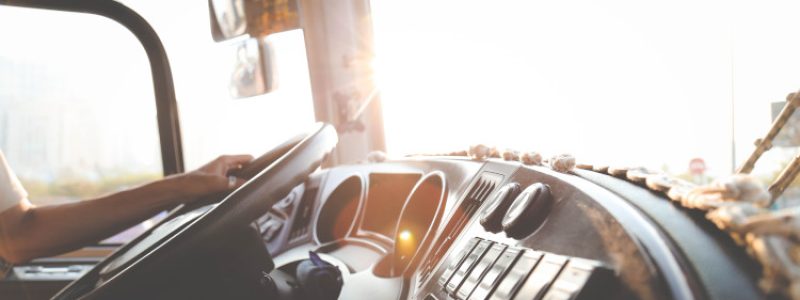 person-hand-on-steering-wheel